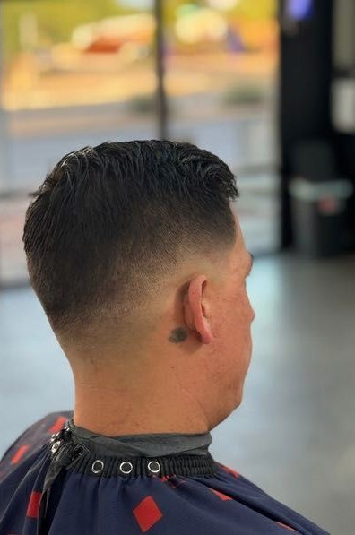 Back view of a short taper fade cut at AZ's